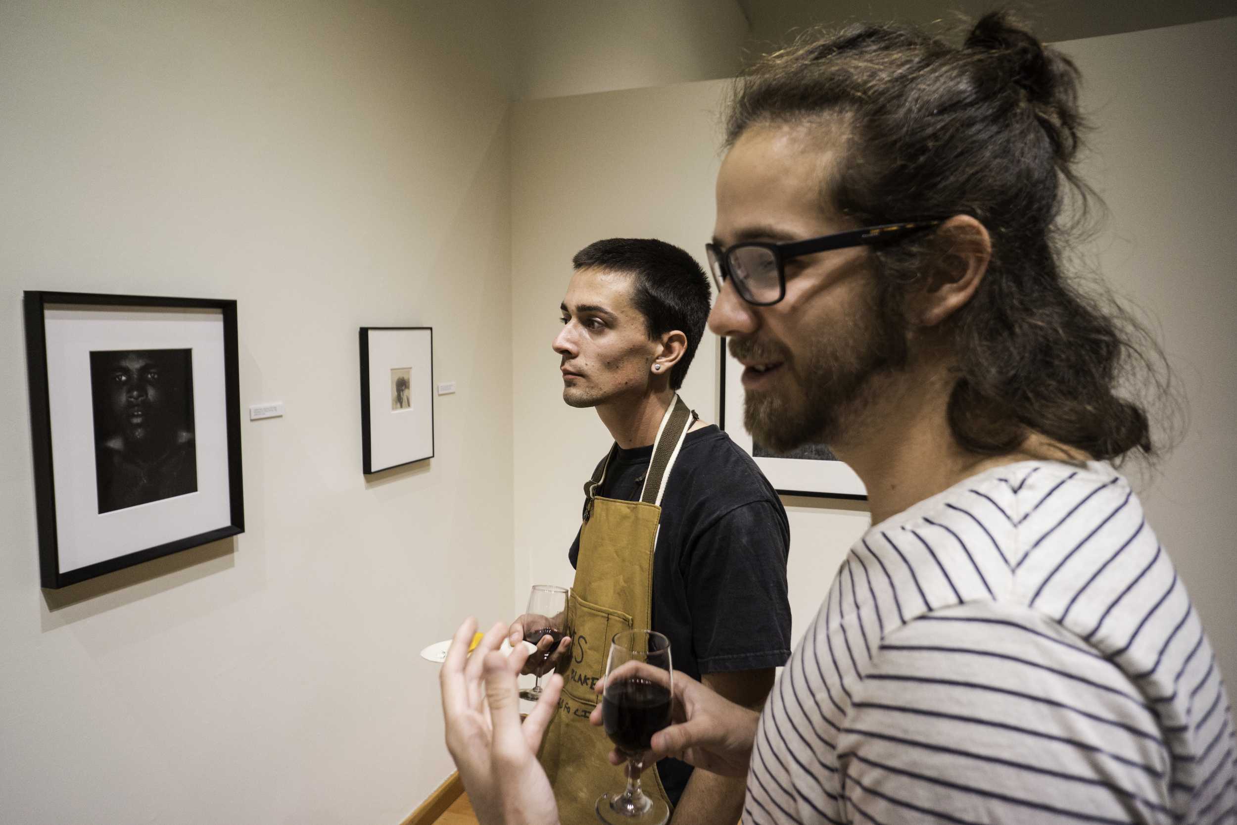 Courtesy // Gustavo VasquezSonoma State University students, faculty, and community membersgather in the University Art Exhibit on Thursday to view an art collection consisting of pieces of work by many photography greats.&nbsp;&nbsp;