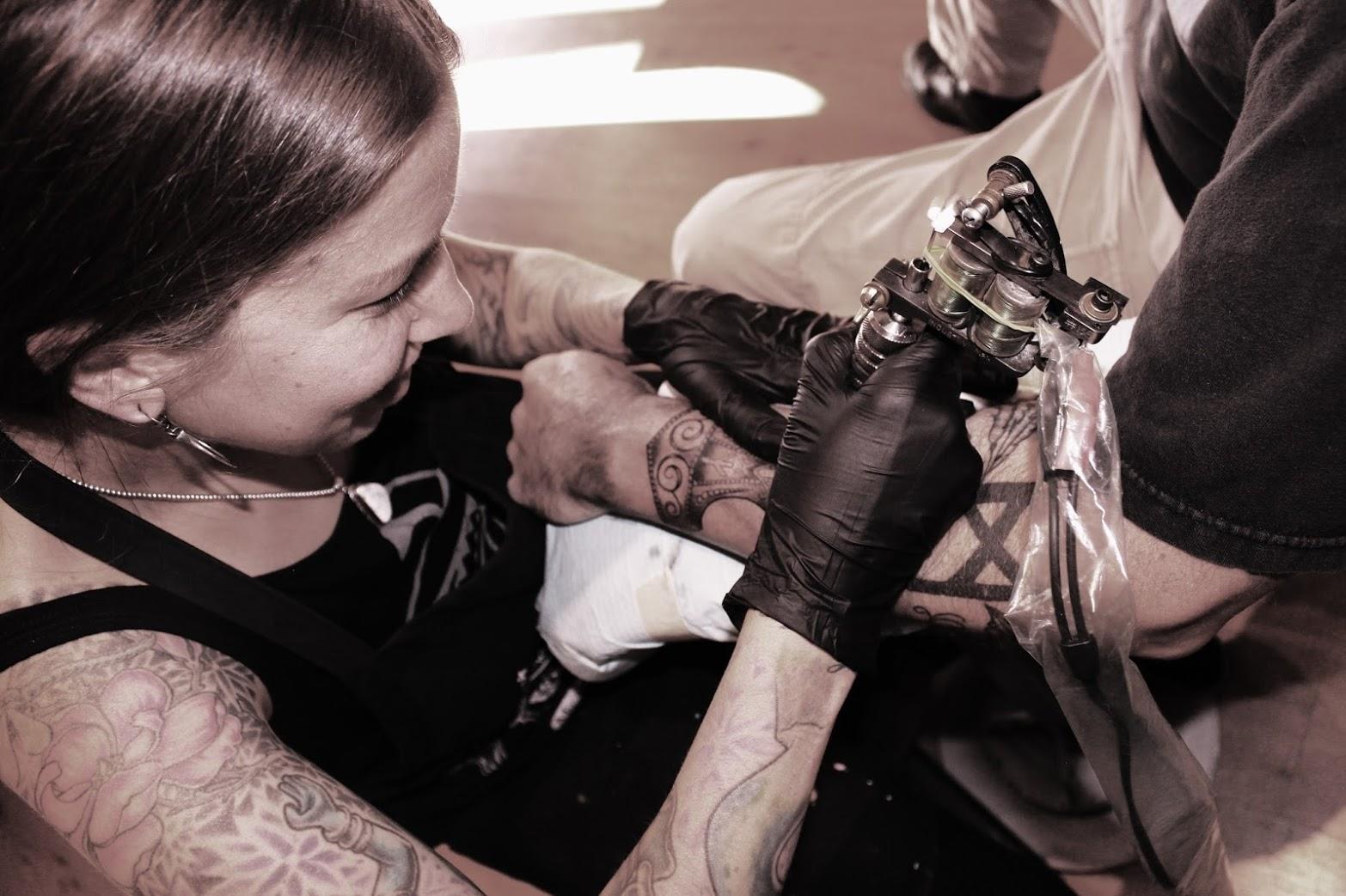 plus.google.comA man gets a tattoo on his arm by Valkyrie Tattoo artist Jennifer Untalan, who spoke at the recent event "Sonoma Ink." A discussion took place during the event, held by Untalan and two other key note speakers, of the taboo and culture…