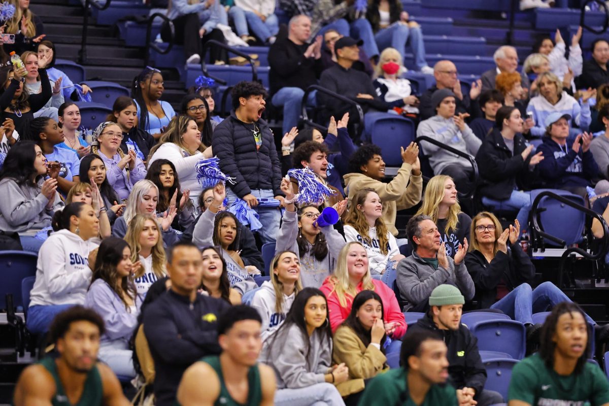 Seawolf community cheering on the players in the intense games. 