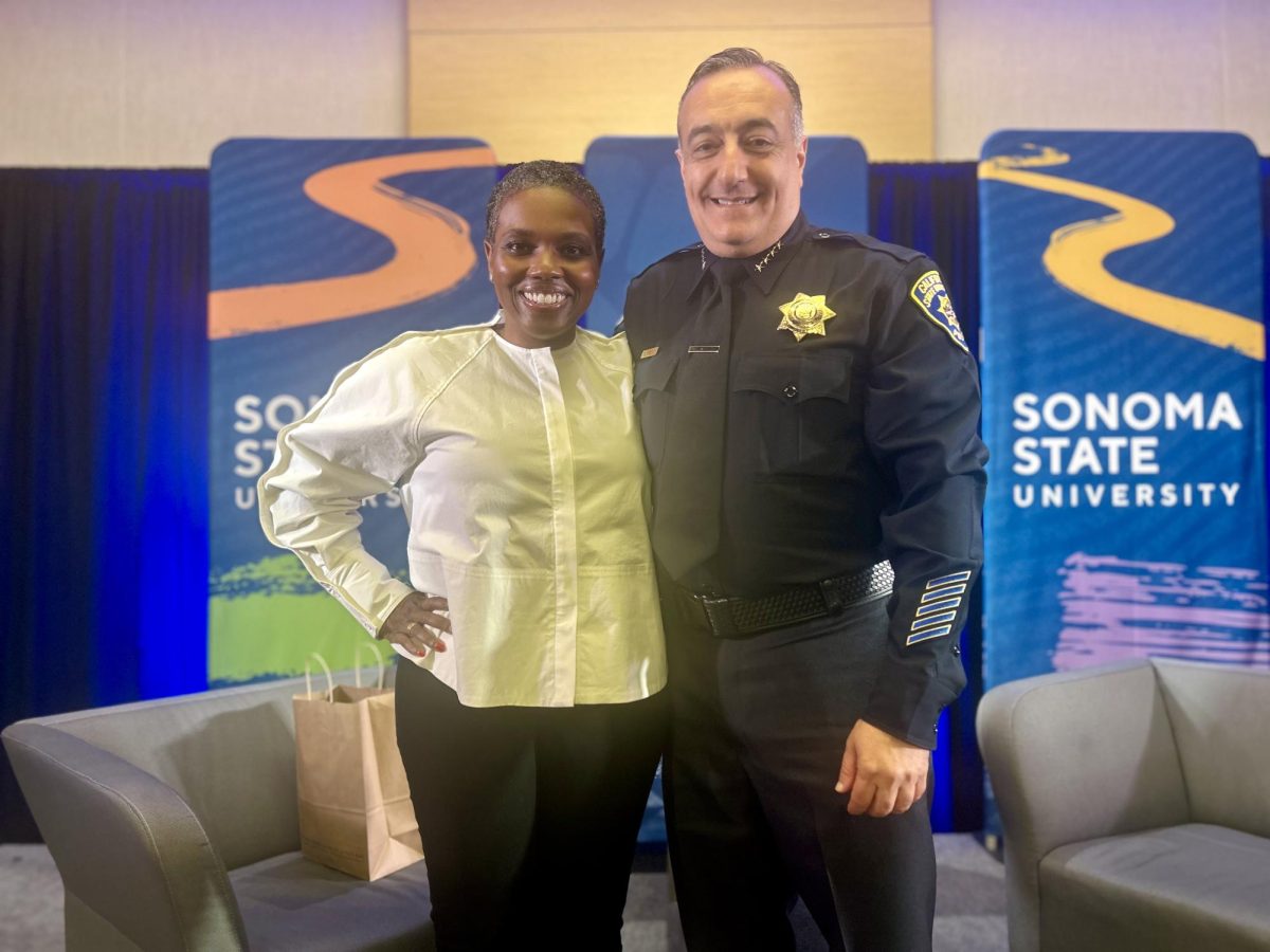 Candice C. Jones and Chief of Police Nader Oweis pose for a photo after the event.