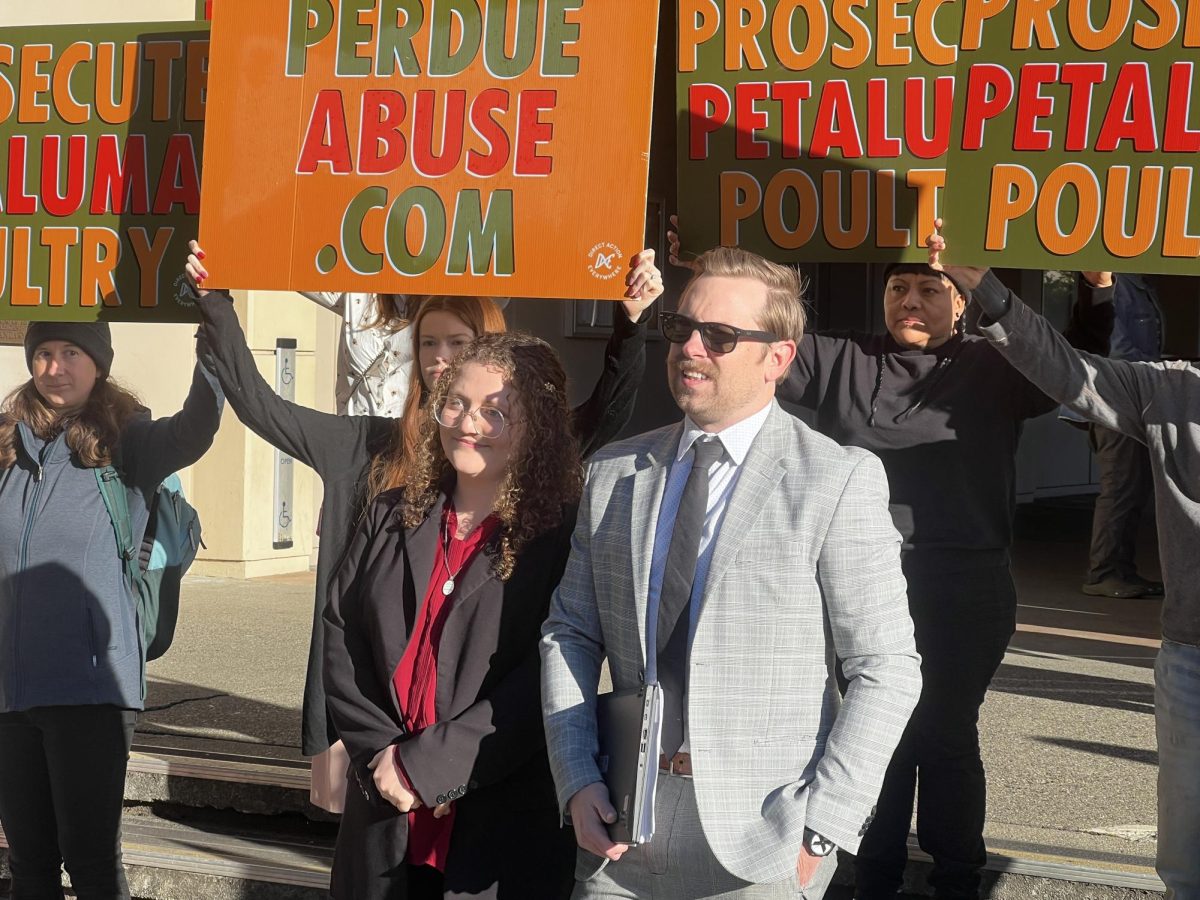 Zoe Rosenberg and her attorney Chris Carraway stand outside the Sonoma County Superior Court on March 3 along with protesters.