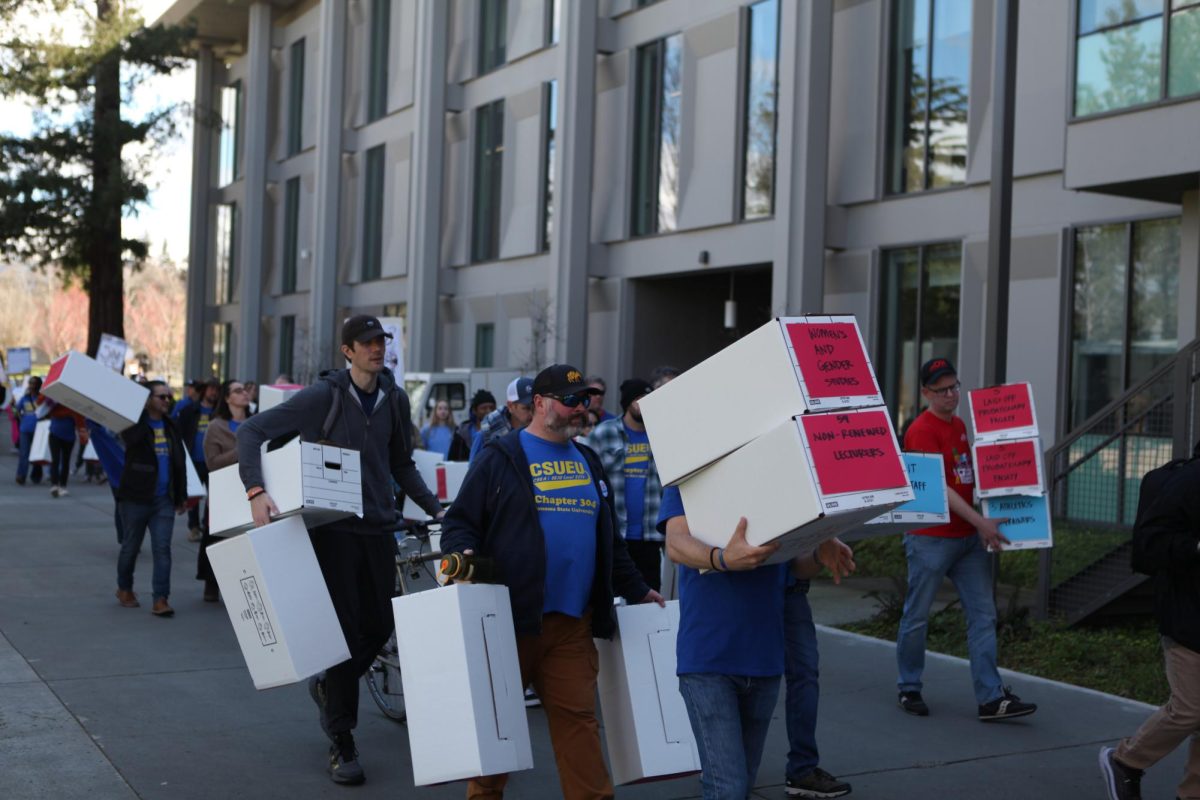 Students, faculty, and staff march to protest budget cuts on March 6. 