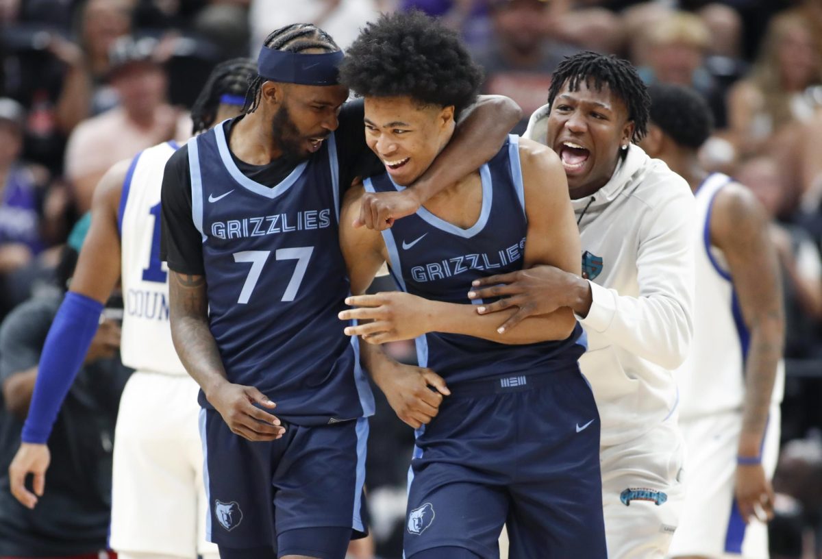 SALT LAKE CITY, UT - JULY 9: Jaylen Wells #0 of the Memphis Grizzlies is hugged by DeJon Jarreau #77 after scoring the game-winning basket at the buzzer during their NBA Summer League game against the Philadelphia 76ers at the Delta Center on July 9, 2024 in Salt Lake City, Utah. NOTE TO USER: User expressly acknowledges and agrees that, by downloading and or using this photographer, user is consenting to the terms and conditions of Getty Images License Agreement.(Photo by Chris Gardner/Getty Images)