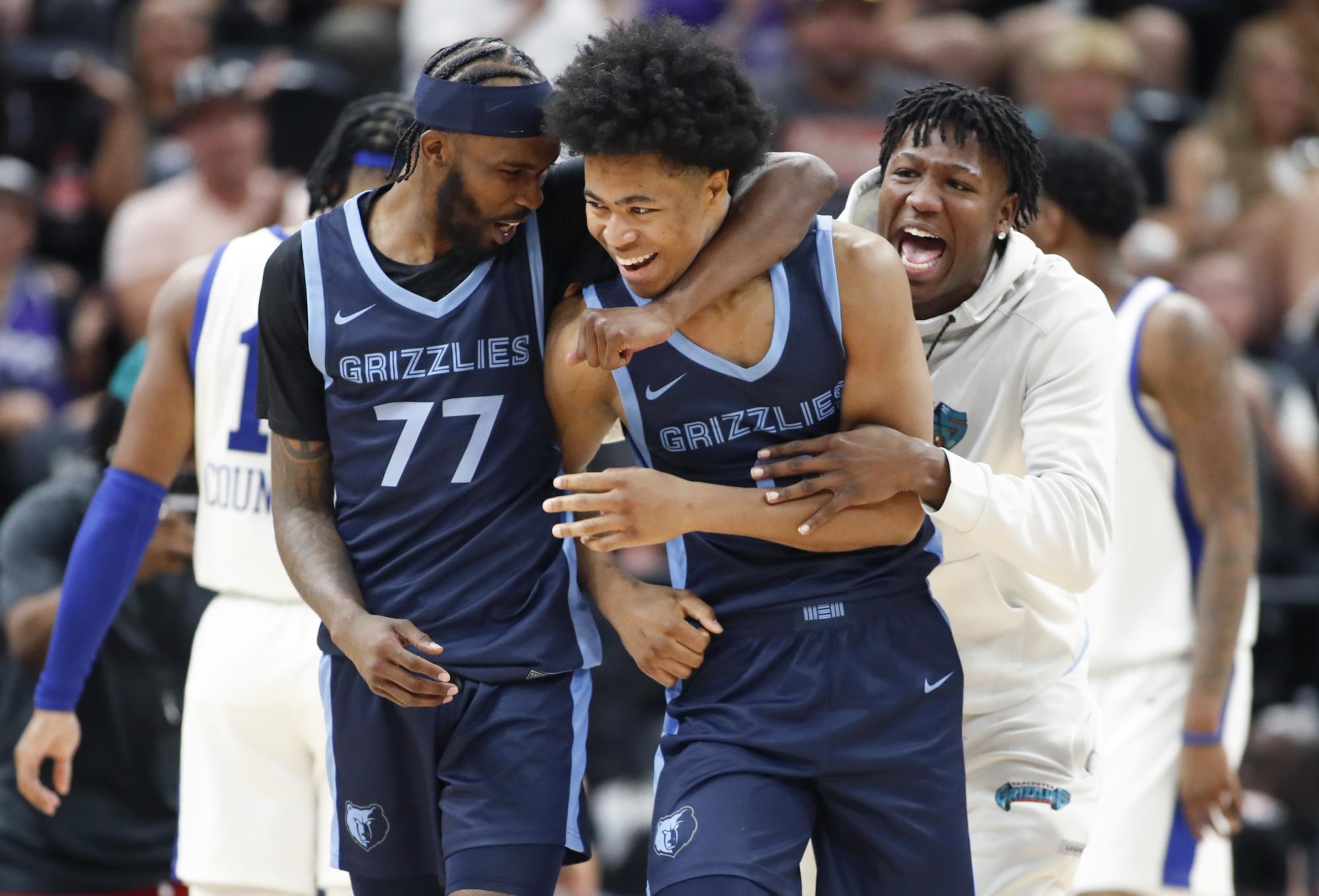 SALT LAKE CITY, UT - JULY 9: Jaylen Wells #0 of the Memphis Grizzlies is hugged by DeJon Jarreau #77 after scoring the game-winning basket at the buzzer during their NBA Summer League game against the Philadelphia 76ers at the Delta Center on July 9, 2024 in Salt Lake City, Utah. NOTE TO USER: User expressly acknowledges and agrees that, by downloading and or using this photographer, user is consenting to the terms and conditions of Getty Images License Agreement.(Photo by Chris Gardner/Getty Images)