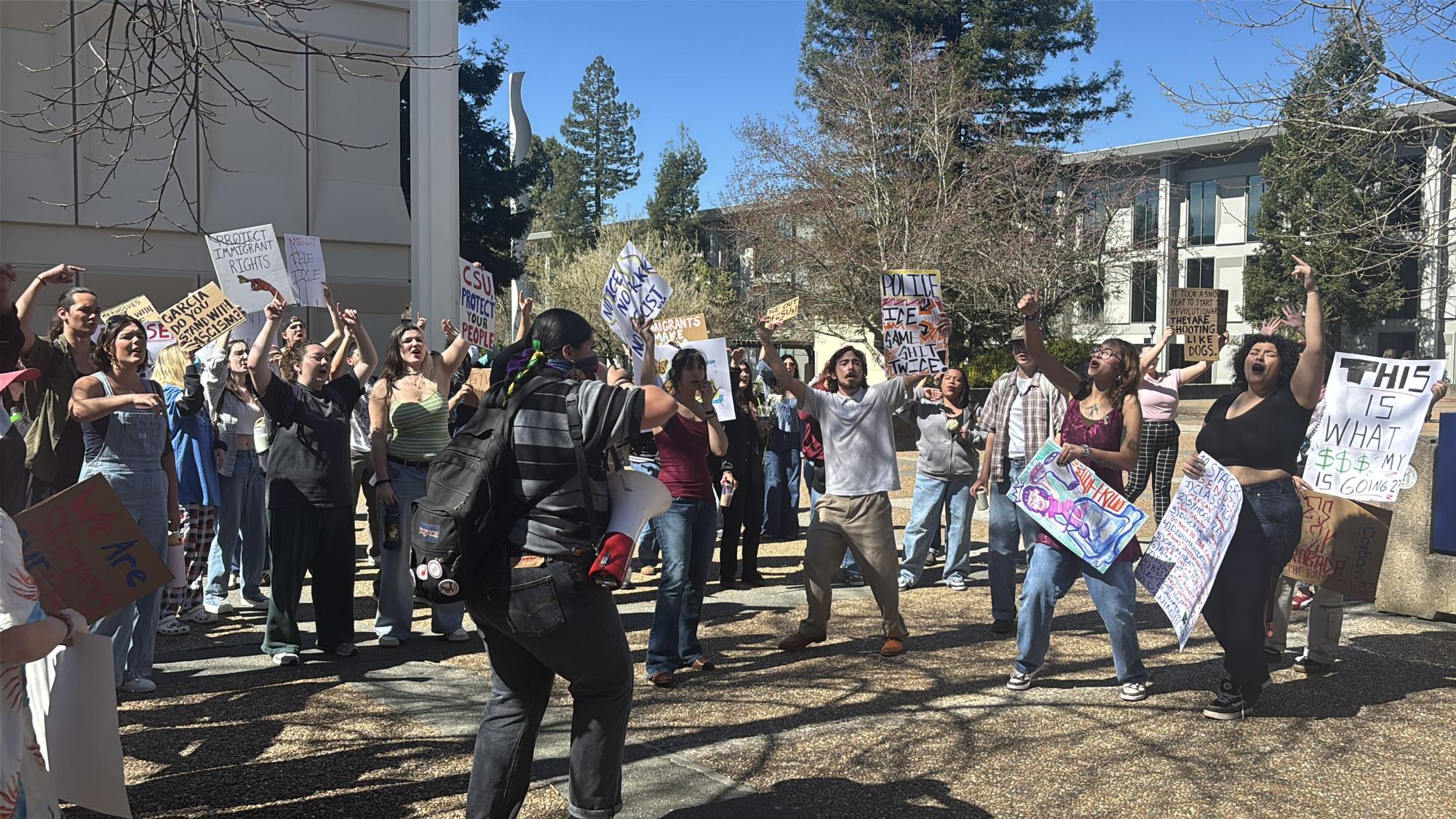 Students march during a walkout at Sonoma State University protesting Immigration and Customs Enforcement (ICE) and supporting immigrant communities.