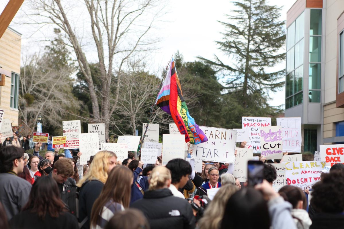 Students and faculty at Sonoma State protest the cuts to 24 academic programs, including Women’s and Gender Studies, on Jan. 30, 2025 in front of a screen on the Seawolf Plaza projecting a virtual town hall meeting.