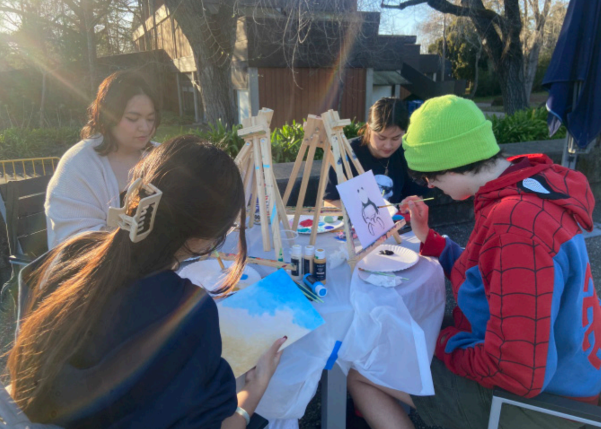 Seawolves working on their paintings at the Wine Spectator patio at SSU on March 4.